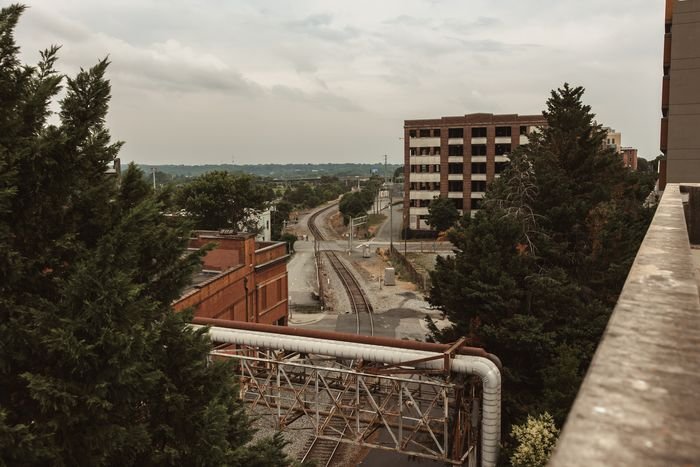 Rail corridor and parking deck seen from a rooftop in downtown Winston-Salem
