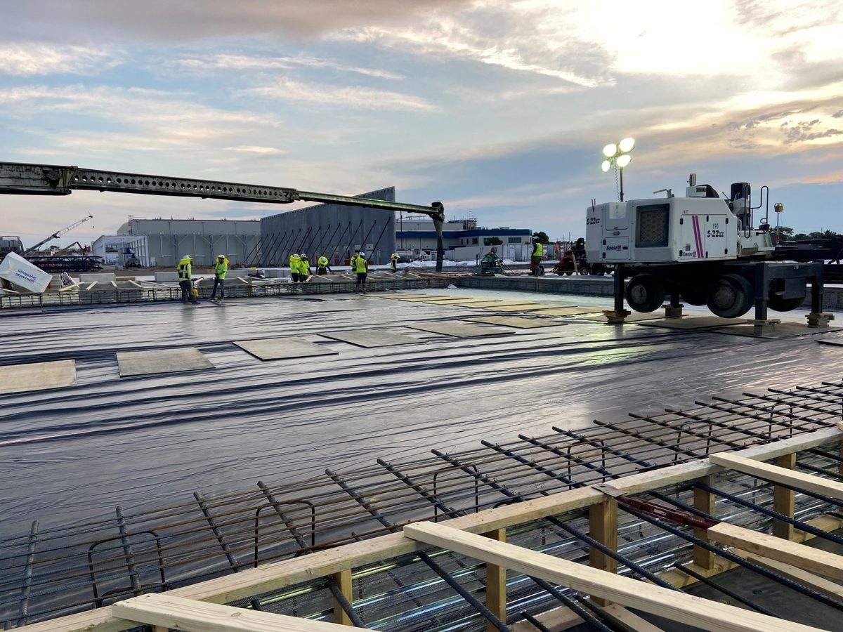 New pre-engineered metal building under construction with columns and temporary shoring