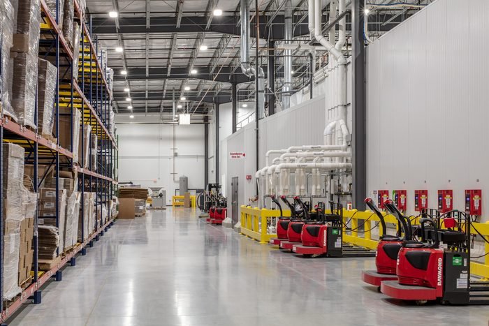 Interior of a cold-storage distribution facility with racking and equipment